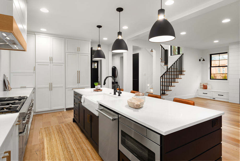 white kitchen with black and white cabinets